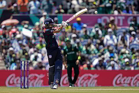 Monank Patel hits a boundary against Pakistan